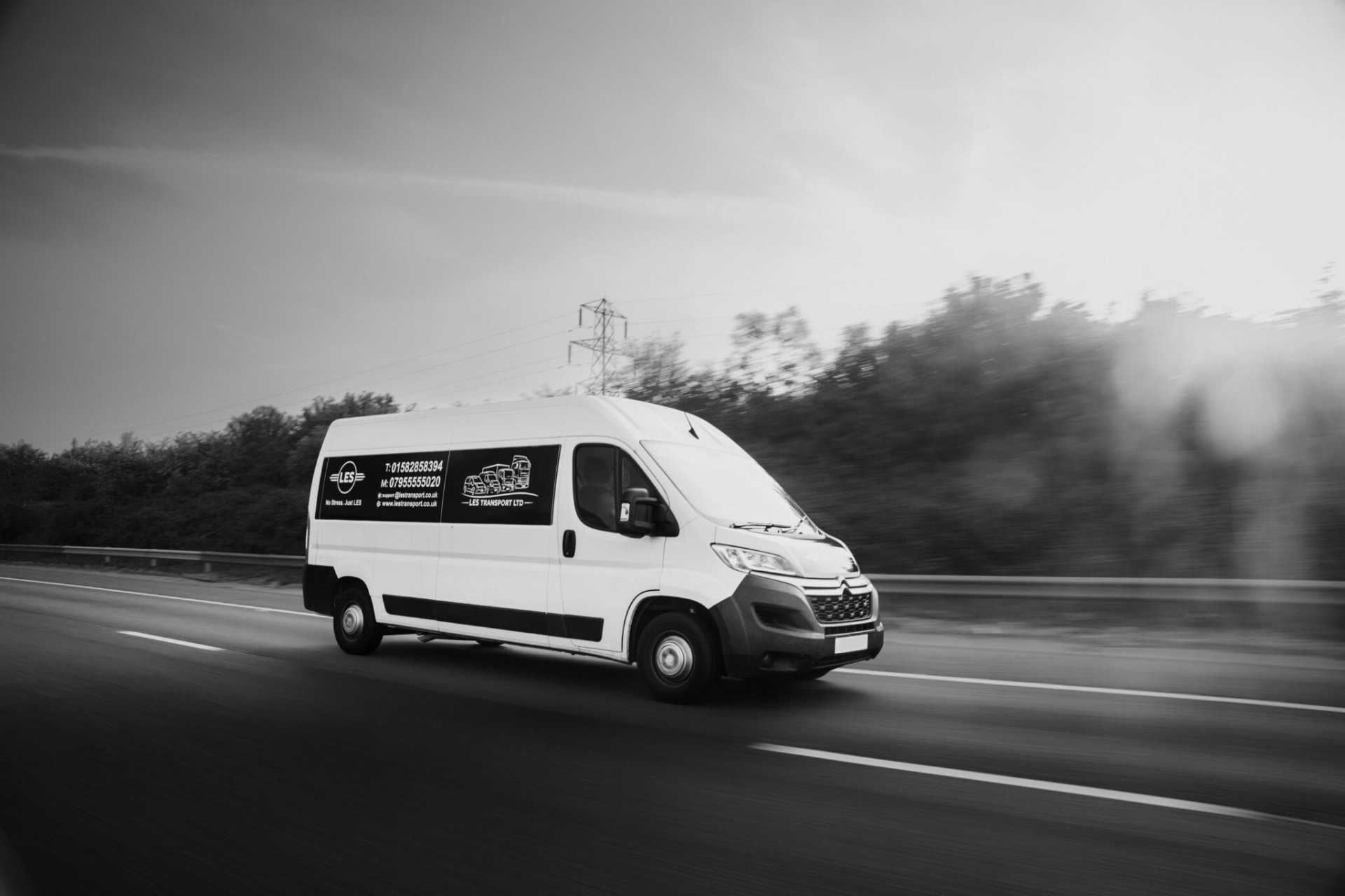 LES Transport van on the road, black and white photograph